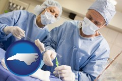 north-carolina map icon and general surgeons preparing for surgery